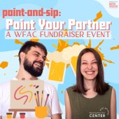 2 people with canvases smiling