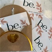 image of nourish at be giftcards with a brown envelope