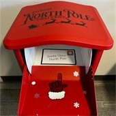 santa's red mailbox with an arrow pointing where letters go