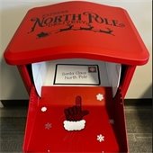 red mailbox with arrow pointing to where santa's letters go