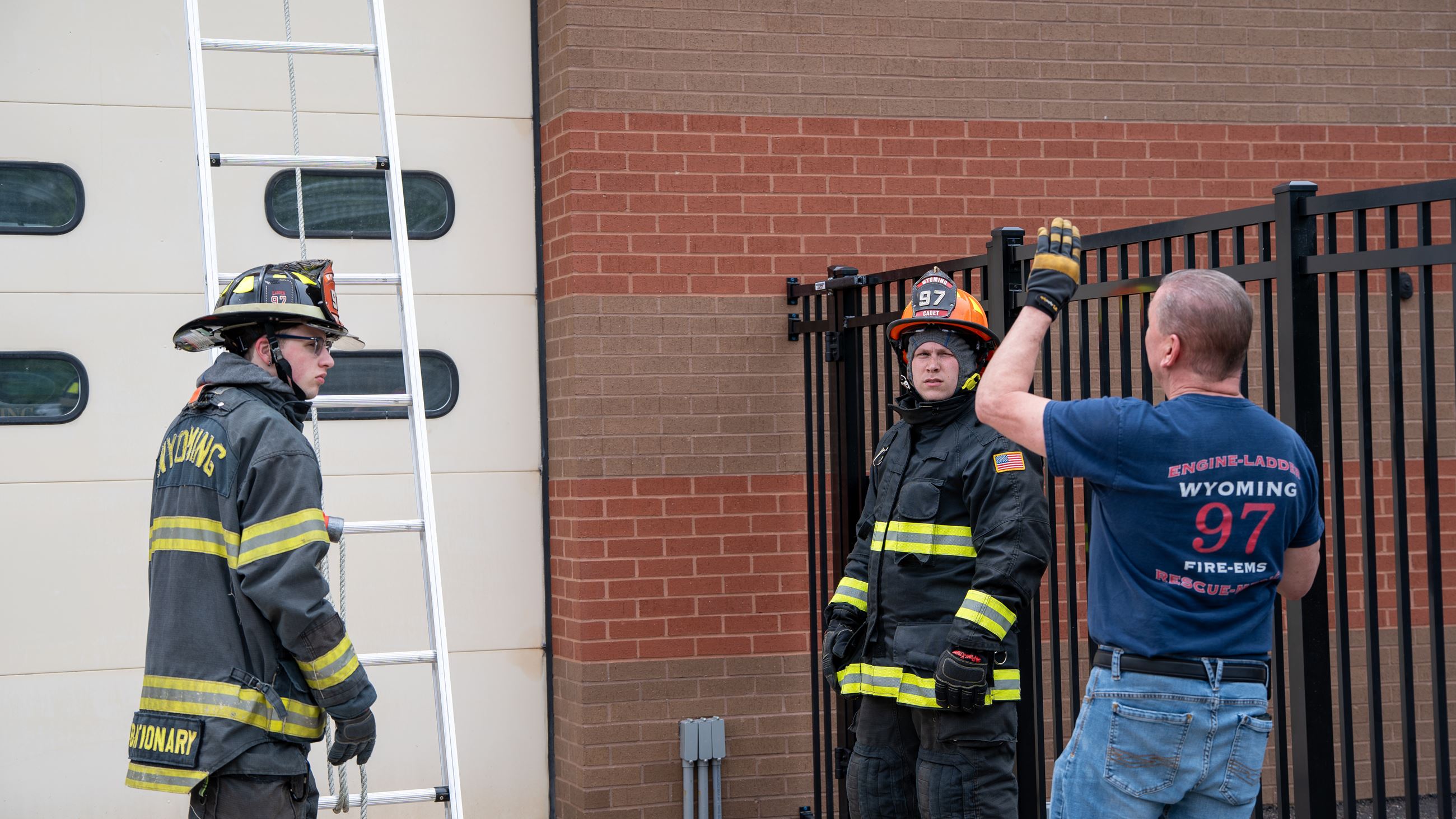 Volunteer fire recruits Carter Woods (left) and Michael Dahlquist review ladder techniques with instructor (who??) during a drill. Carter Woods is a 2025 graduate of Wyoming's Fire Cadet program who said he has been interested in becoming a volunteer firefighter since seventh grade after meeting an older cadet. He described the cadet program as "The most fun four years I've ever had. The fire department has become my second family."